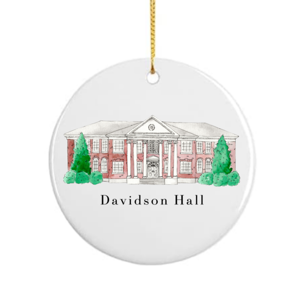 A white ceramic ornament, flat, with a drawing of Davidson Hall on it